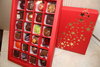 Weihnachtsbox rot - gold mit 24 Pralinen